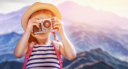 this is an image of a young girl with a camera