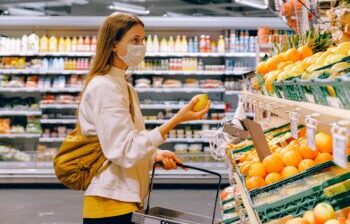 Lady wearing mask buying fruit
